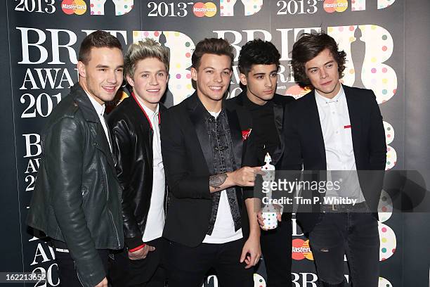 Liam Payne, Niall Horan, Louis Tomlinson, Zayn Malik and Harry Styles of One Direction pose with their Brits Global Success Award in the press room...