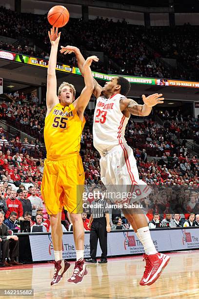 Elliott Eliason of the Minnesota Golden Gophers shoots over Amir Williams of the Ohio State Buckeyes in the first half on February 20, 2013 at Value...