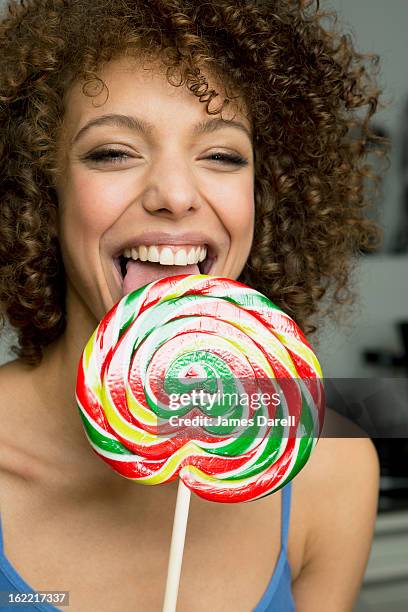 Girl Licking Lollipop High-Res Stock Photo - Getty Images