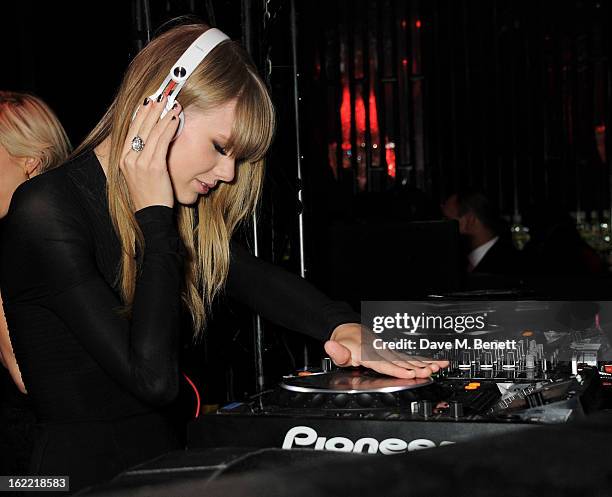 Taylor Swift DJ's at the Universal Music Brits Party hosted by Bacardi at the Soho House pop-up on February 20, 2013 in London, England.