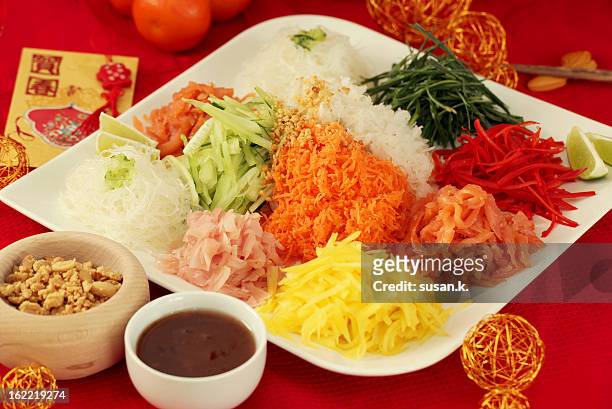 yusheng for chinese new year - prosperity toss stock pictures, royalty-free photos & images