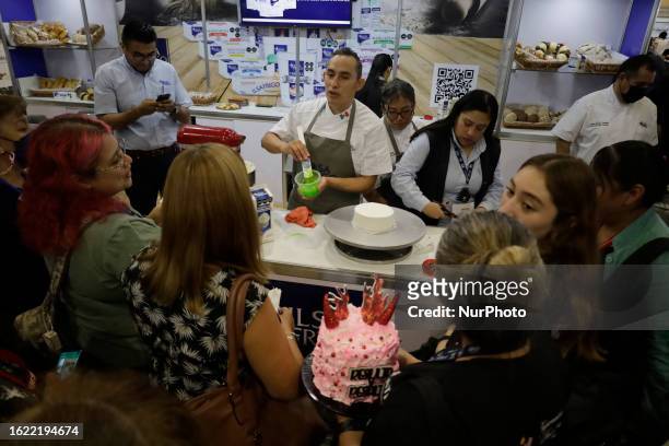Dozens of people attend the Expo Pan at the World Trade Center in Mexico City, where suppliers of bakery and pastry tools offer their products, which...