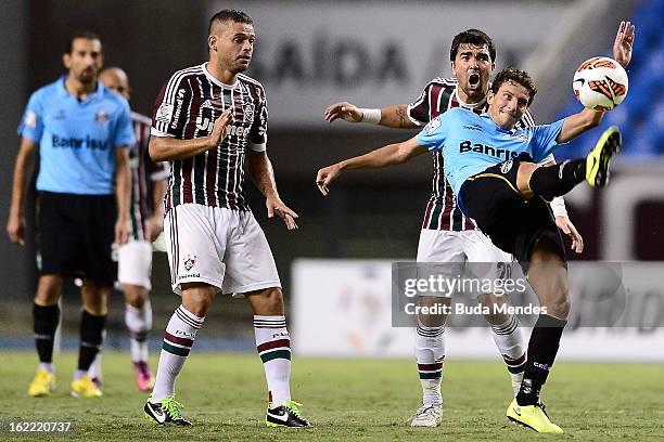Edinho and Deco of Fluminense struggles for the ball with Elano of Gremio during a match between Fluminense and Gremio as part of the Copa...