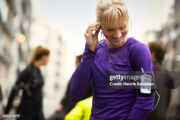 runners preparing in urban invironment - danish sports stock pictures, royalty-free photos & images