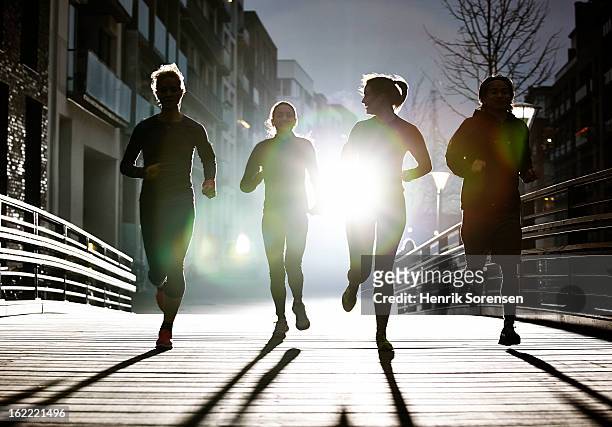 small group of runners - running stock pictures, royalty-free photos & images