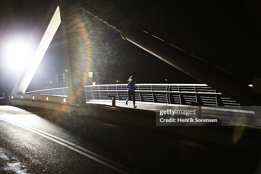 Lonely runner on bridge