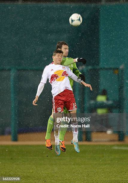 Ruben Izquierdo of the New York Red Bulls and Zach Scott of the Seattle Sounders both attempt to head the ball at Kino Sports Complex on February 20,...