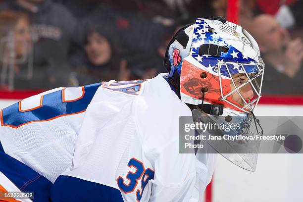 Rick DiPietro of the New York Islanders looks on during an NHL game against the Ottawa Senators at Scotiabank Place on February 19, 2013 in Ottawa,...