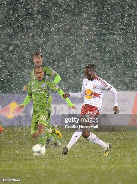 Lloyd Sam of the New York Red Bulls and David Estrada of the Seattle Sounders battle for possesion at Kino Sports Complex on February 20, 2013 in...