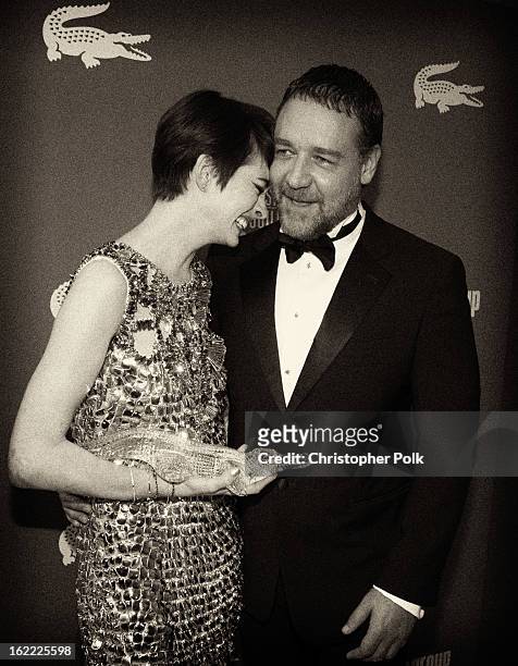 Spotlight Award recipient Anne Hathaway and presenter Russell Crowe attend the 15th Annual Costume Designers Guild Awards with presenting sponsor...