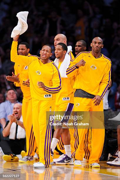 Chris Duhon and Kobe Bryant of the Los Angeles Lakers celebrate from the sideline after a dunk by teammate Earl Clark against the Boston Celtics at...