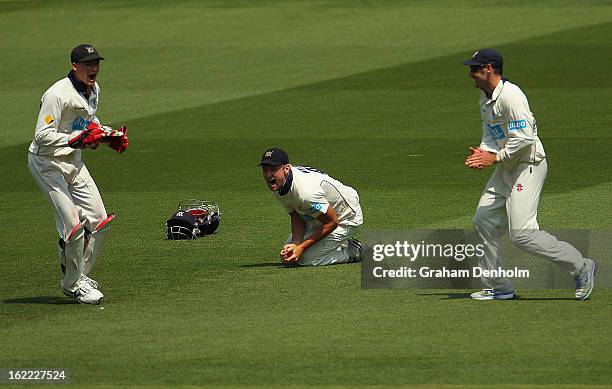 Cameron White of the Bushrangers celebrates catching out Dominic Michael of the Bulls during day four of the Sheffield Shield match between the...