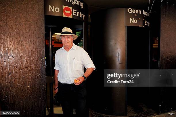 Oscar Pistorius's father, Henke Pistorius, leaves the Pretoria Magistrate Court on February 20, 2013 in Pretoria, South Africa. Oscar Pistorius, who...