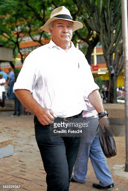 Oscar Pistorius's father, Henke Pistorius, leaves the Pretoria Magistrate Court on February 20, 2013 in Pretoria, South Africa. Oscar Pistorius, who...