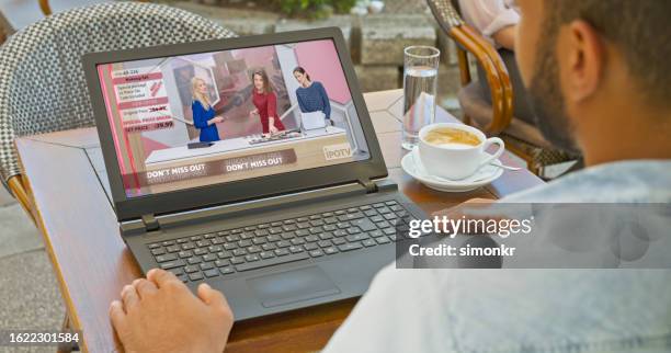 man sitting at sidewalk cafe - television advertisement stock pictures, royalty-free photos & images