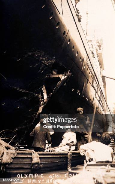 Inspecting the damage to the RMS Olympic after its collision with the British warshiip HMS Hawke off the Isle of Wight on 20th September 1911.