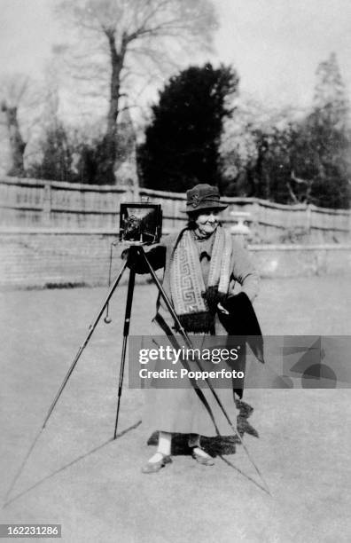 Mrs Albert Broom, nee Christina Livingston, the United Kingdom's first female press photographer, with her camera, photographed by a member of the...