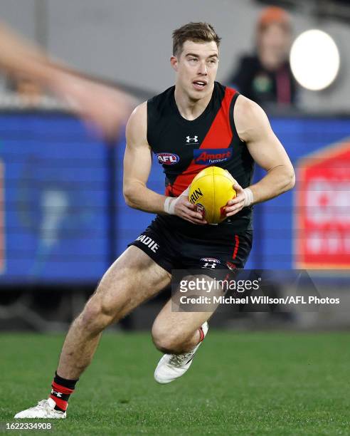 Zach Merrett of the Bombers in action during the 2023 AFL Round 24 match between the Essendon Bombers and the Collingwood Magpies at Melbourne...