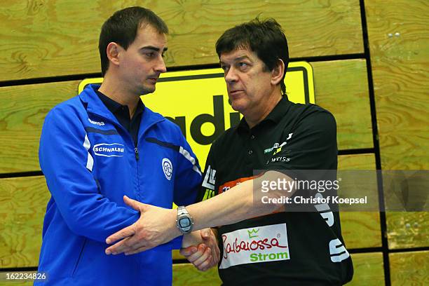 Head coach Emir Kurtagic and head coach Velimir Petkovic of Goeppingen shake hands prior to the DKB Handball Bundesliga match between VfL Gummersbach...
