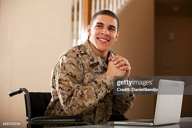 disabled veteran us marine soldier in wheelchair - army soldier smiling stock pictures, royalty-free photos & images