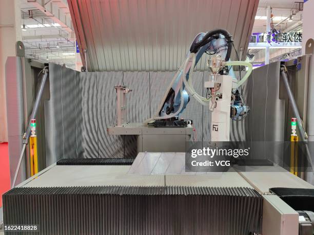 Printer robot is on display during 2023 World Robot Conference at Beijing Etrong International Exhibition & Convention Center on August 18, 2023 in...