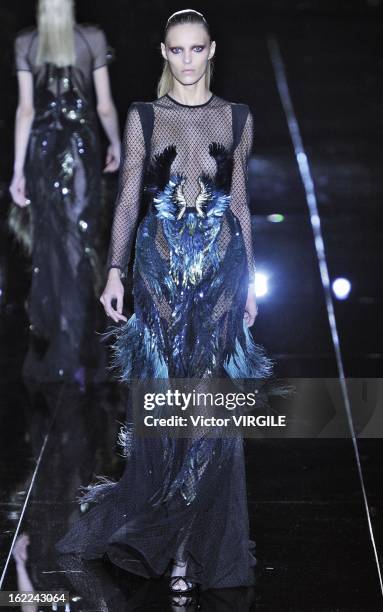 Model walks the runway during the Gucci Ready to Wear Fall/Winter 2013-2014 show as part of the Milan Fashion Week Womenswear Fall/Winter 2013/14 on...