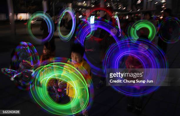 South Koreans spin illuminated sticks during 'Cyber Jwibulnoli' at Everland on February 21, 2013 in Seoul, South Korea. Jwibulnoli is originally...