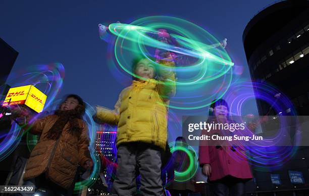 South Korean children spin illuminated sticks during 'Cyber Jwibulnoli' at Everland on February 21, 2013 in Seoul, South Korea. Jwibulnoli is...