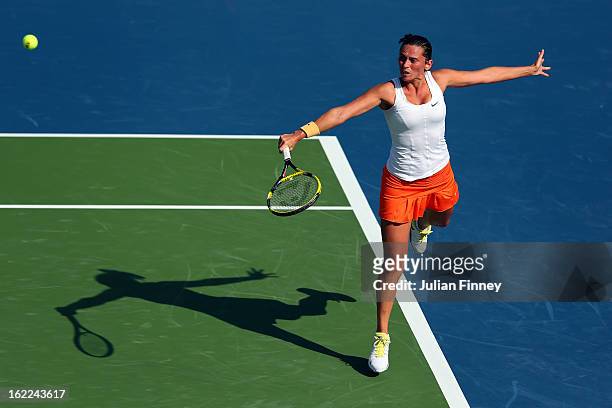 Roberta Vinci of Italy plays a backhand in her match against Samantha Stosur of Australia during day four of the WTA Dubai Duty Free Tennis...