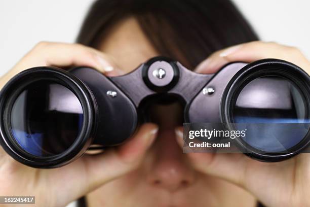 searching with binoculars - looking through binoculars stock pictures, royalty-free photos & images
