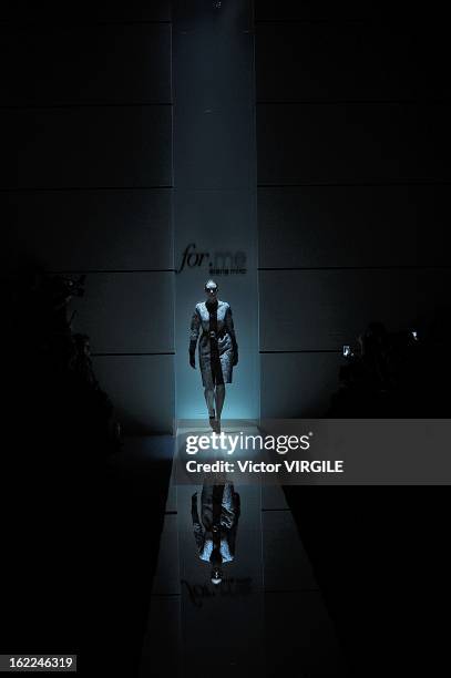 Model walks the runway during the Elena Miro Ready to Wear Fall/Winter 2013-2014 show as part of the Milan Fashion Week Womenswear Fall/Winter...