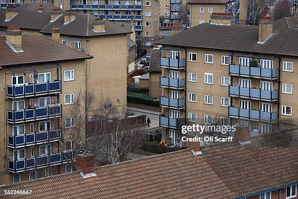 Woman walks past a residential development in the London borough of Tower Hamlets on February 21, 2013 in London, England. A recent study has shown...