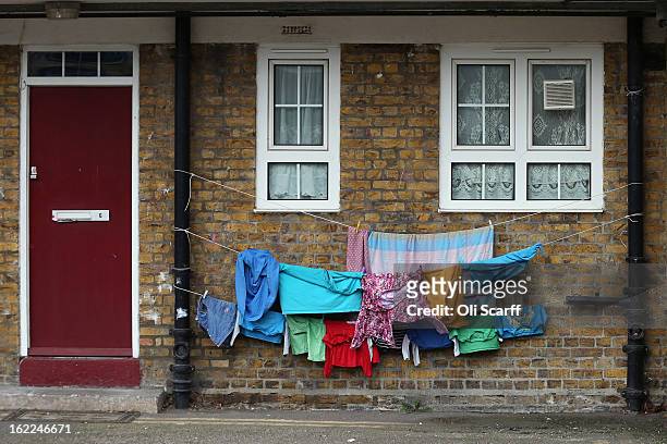 Children's clothing is hung out to dry on a residential development in the London borough of Tower Hamlets on February 21, 2013 in London, England. A...