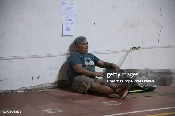 Person with his dog in the pavilion of IES Sabino Berthelot, on August 18 in El Sauzal, Tenerife, Canary Islands, Spain. The forest fire that started...