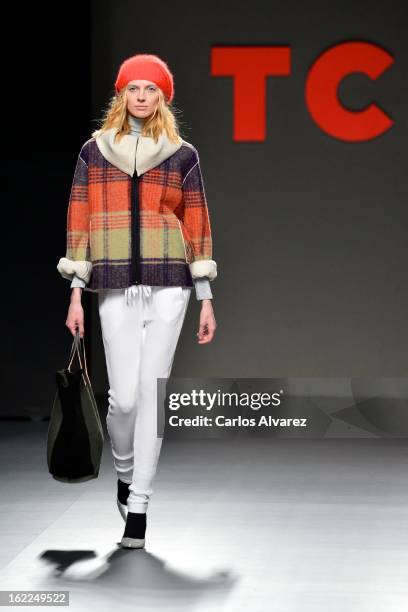 Model showcases designs by TCN on the runway at the TCN show during Mercedes Benz Fashion Week Madrid Fall/Winter 2013/14 at Ifema on February 21,...