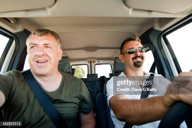 two men in a car - vehicle seat stock pictures, royalty-free photos & images