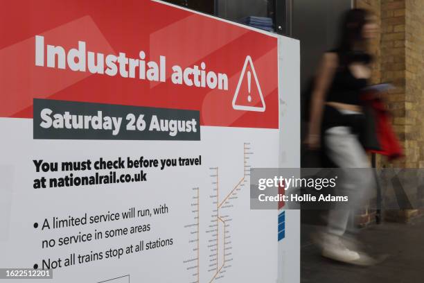 Notice displays information about reduced services due to industrial action at King's Cross station on August 25, 2023 in London, England. Tomorrow...