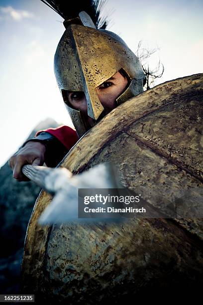 spartan in defense position - greece costume stock pictures, royalty-free photos & images