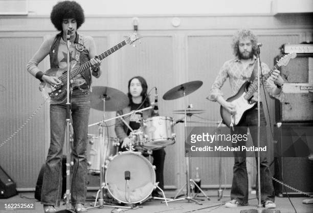 Irish rock group Thin Lizzy rehearsing in London, 1973. Left to right: bassist and singer Phil Lynott , drummer Brian Downey, and guitarist Eric Bell.