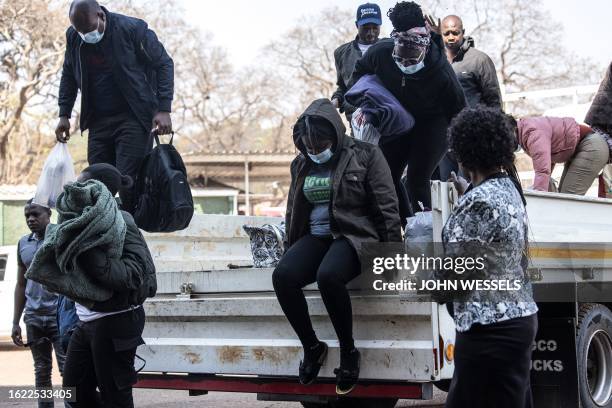 Around 3 dozen local election observers arrive ahead of their court hearing at the Harare Magistrates Court, on August 25, 2023. More than 3 dozen...