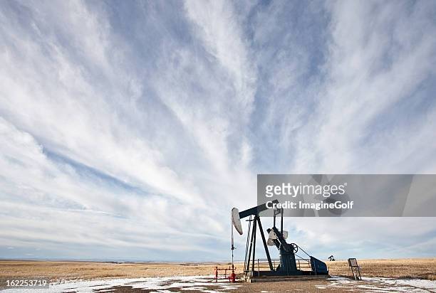 pumpjack on the plains - lethbridge alberta stock pictures, royalty-free photos & images
