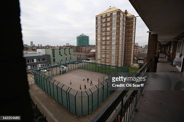 Children play a game of football in front of a residential development in the London borough of Tower Hamlets on February 21, 2013 in London,...