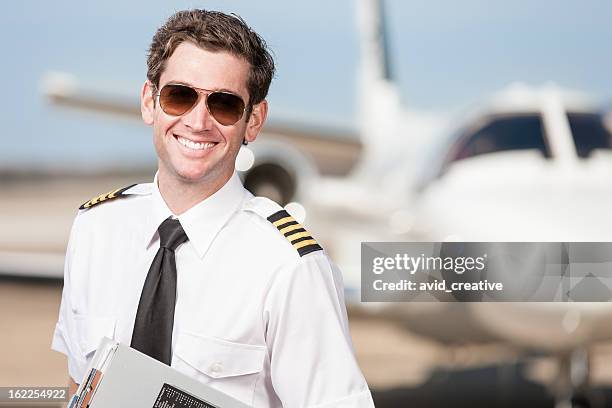 happy corporate pilot portrait - aviator sunglasses stock pictures, royalty-free photos & images