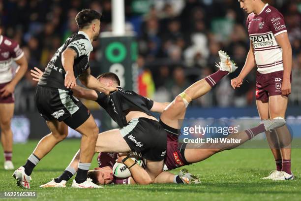 Reuben Garrick of the Sea Eagles is tackled during the round 25 NRL match between New Zealand Warriors and Manly Sea Eagles at Mt Smart Stadium on...