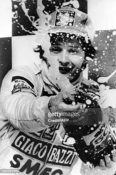 Ferrari driver Gilles Villeneuve of Canada celebrates his second place on the Grand Prix of Montreal during the podium ceremony, on September 30,...