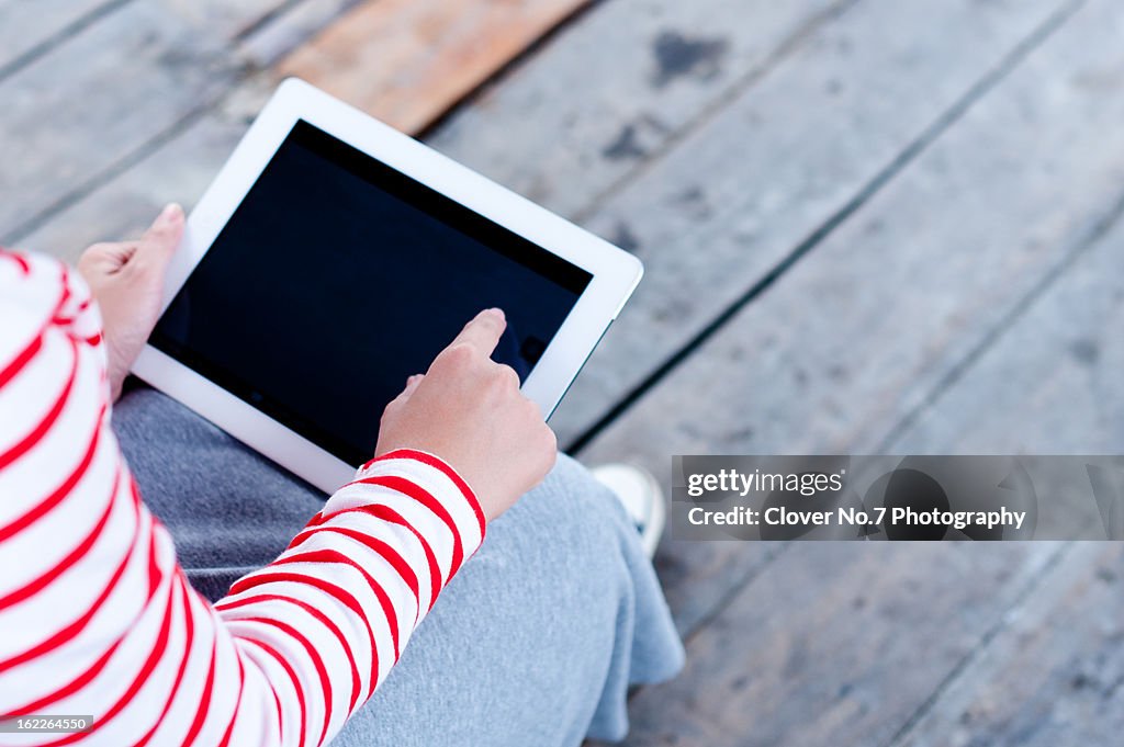Women use digital tablet