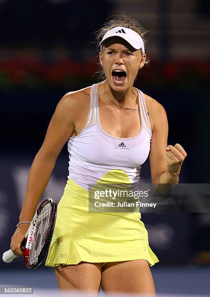 Caroline Wozniacki of Denmark celebrates winning a game against Marion Bartoli of France during day four of the WTA Dubai Duty Free Tennis...