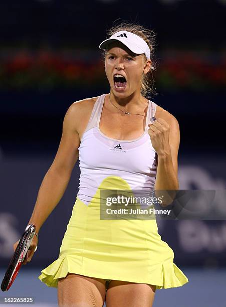 Caroline Wozniacki of Denmark celebrates winning a game against Marion Bartoli of France during day four of the WTA Dubai Duty Free Tennis...