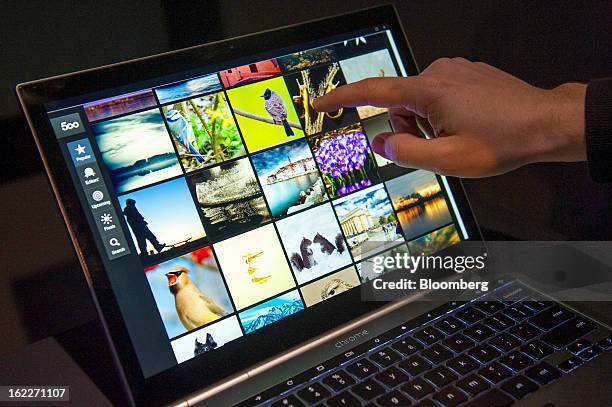 An attendee tries out the new Google Inc. Chromebook Pixel laptop during a launch event in San Francisco, California, U.S., on Thursday, Feb. 21,...