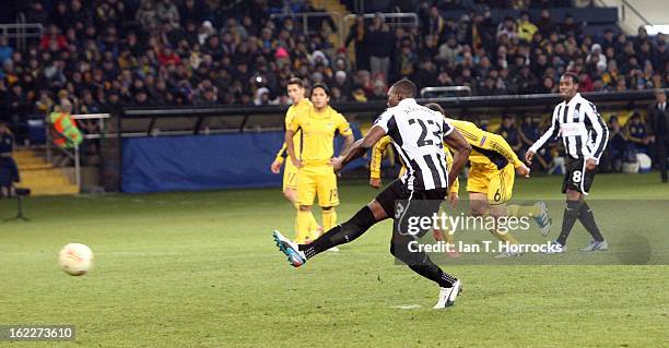 Shola Ameobi of Newcastle United scores from the penalty spot during the UEFA Europa League round of 32 second leg match between FC Metalist Kharkiv...